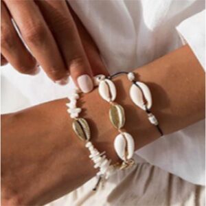 Three piece set of shell bracelets